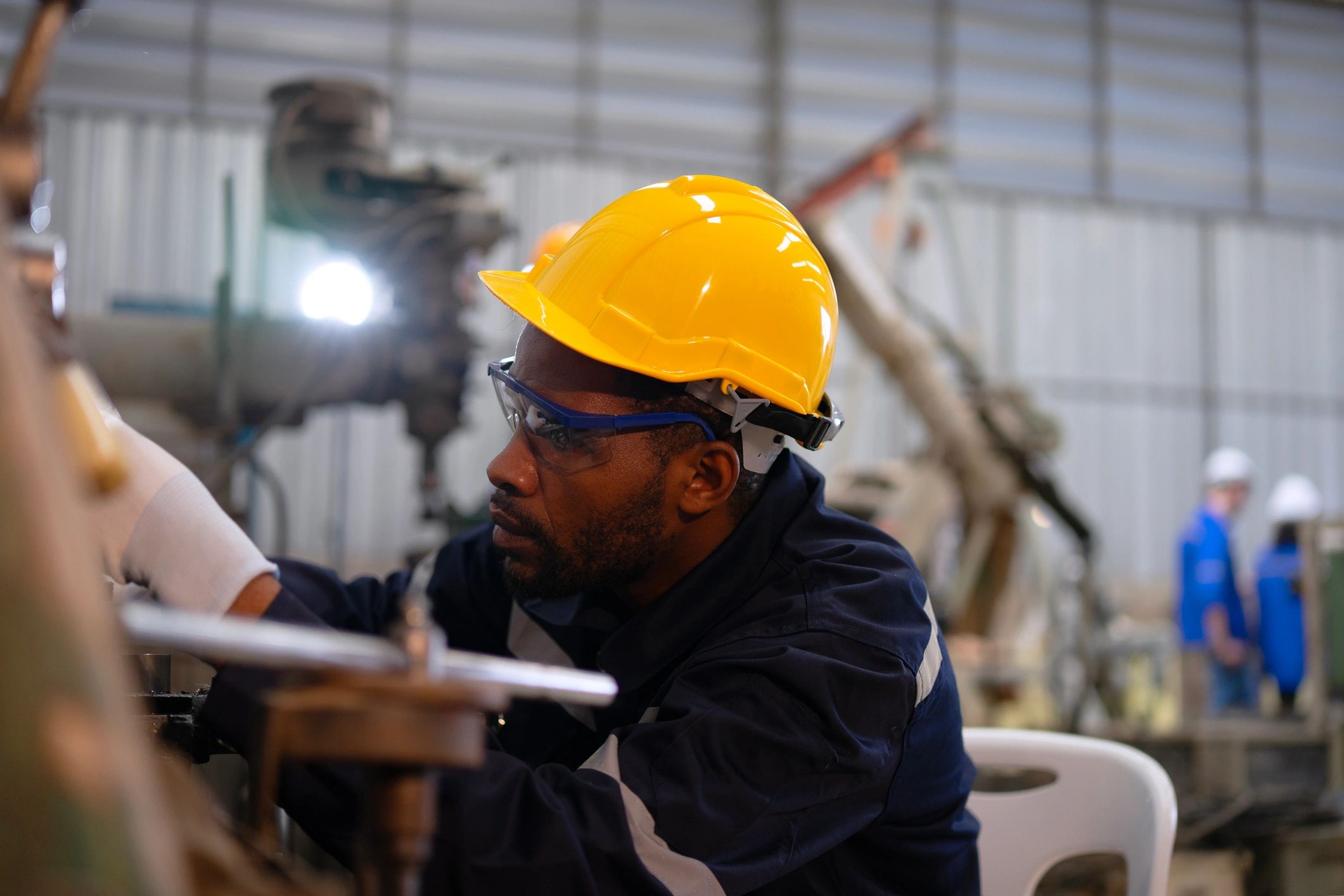 Technicians working in a modern service bay with equipment
